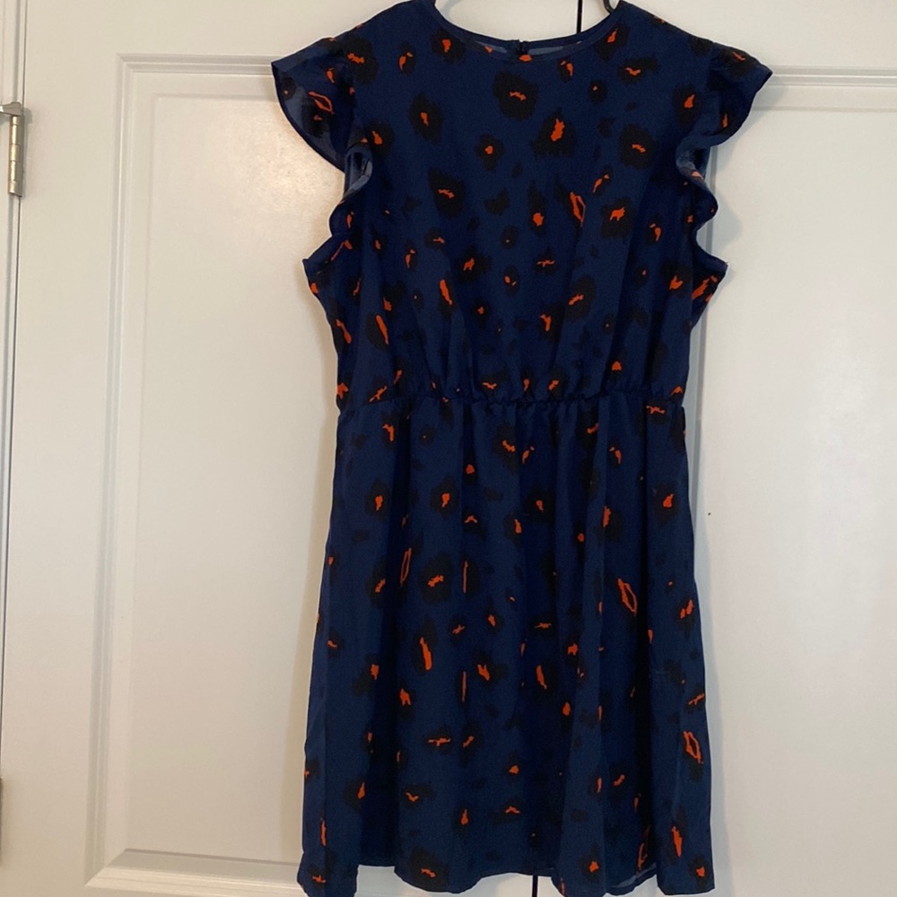 Ladies navy dress with black and orange details; ruffle sleeves
